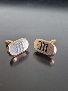 Gold Tone Oval Cufflinks with Black 'M' Monogram